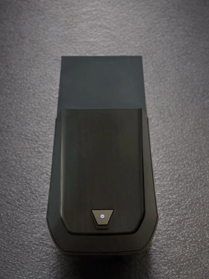 Refurbished black gaming PC tower with power button on textured surface