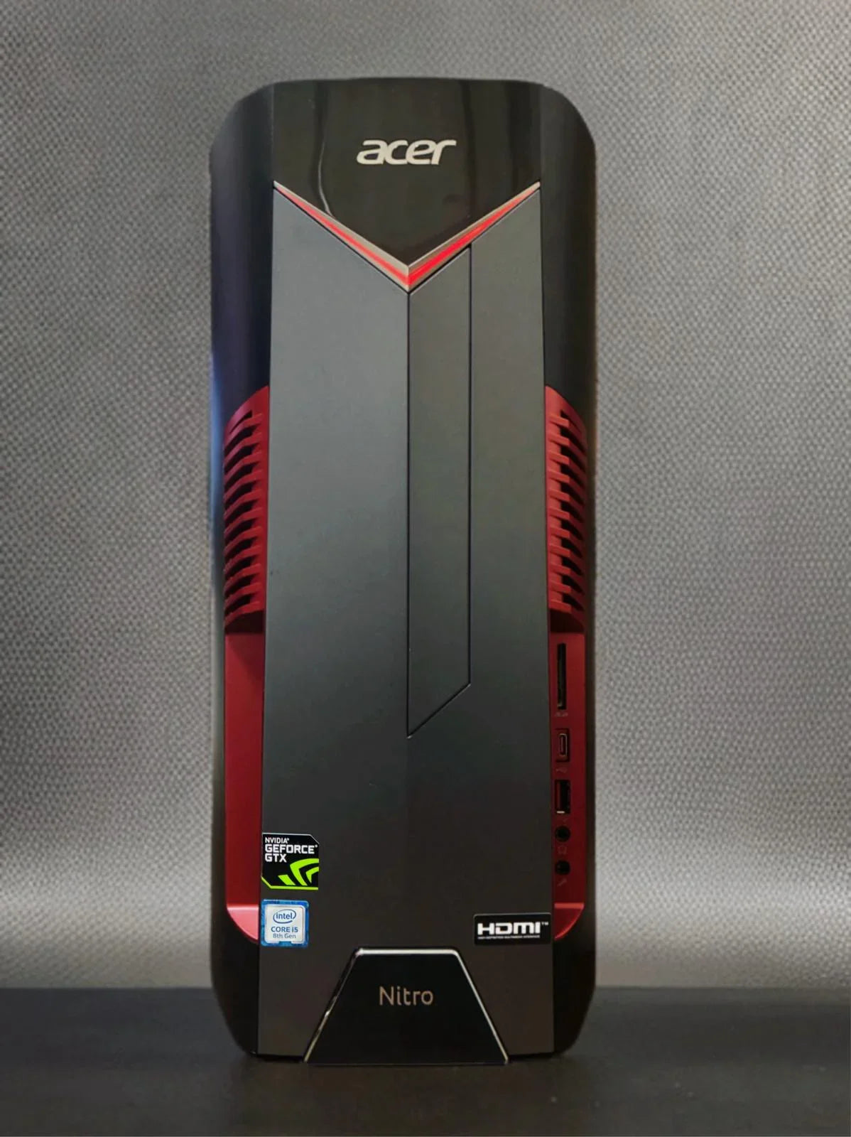 Front view of Acer Nitro gaming PC desktop with red accents, GeForce GTX and Intel Core i5 badges