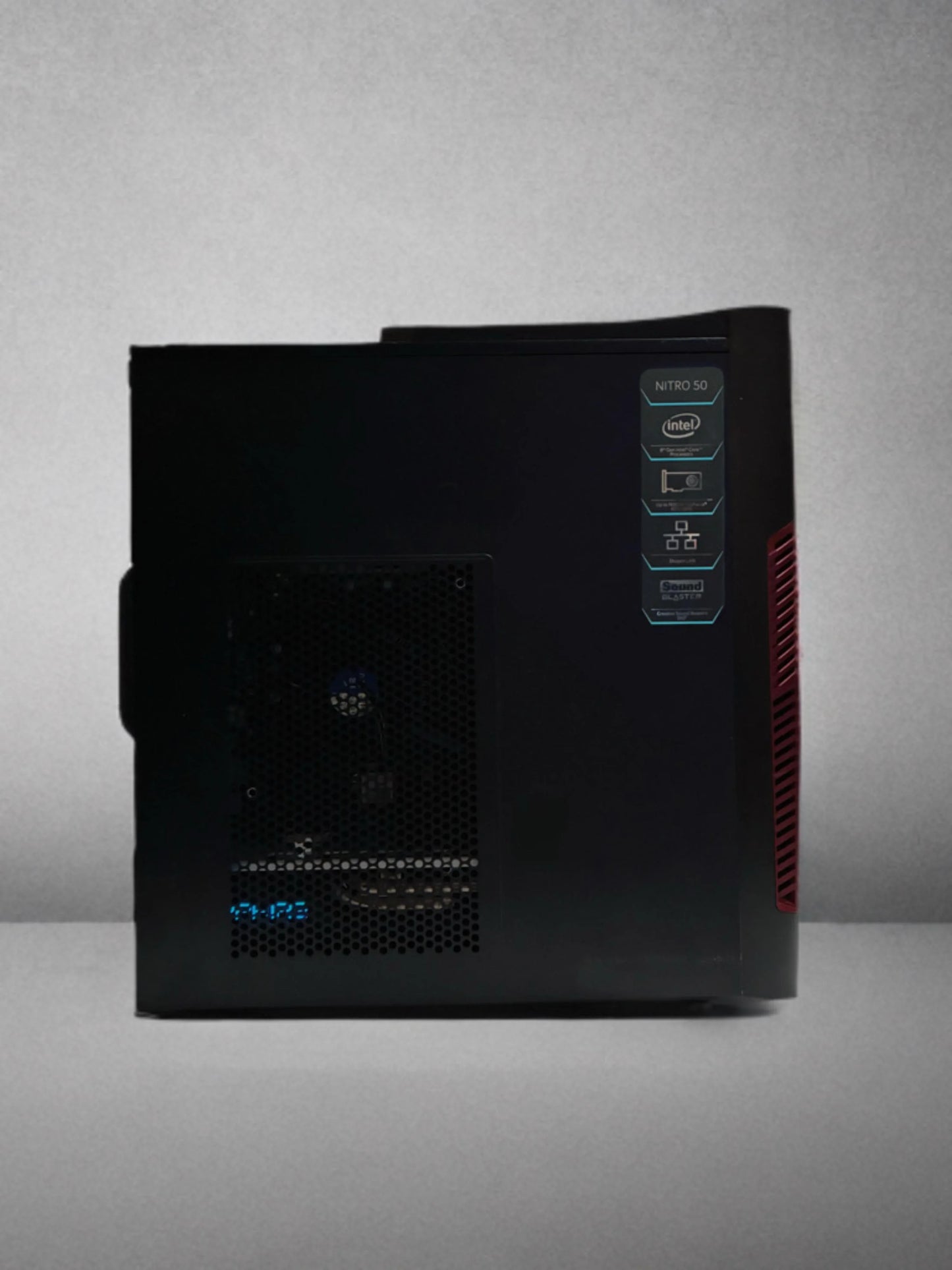 Refurbished Acer Nitro 50 gaming PC with Intel processor, side panel view, on gray background